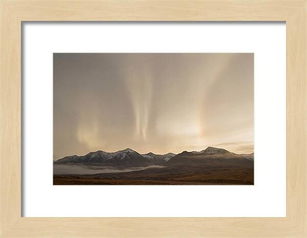 Aurora Pillars Rising Above Mountains