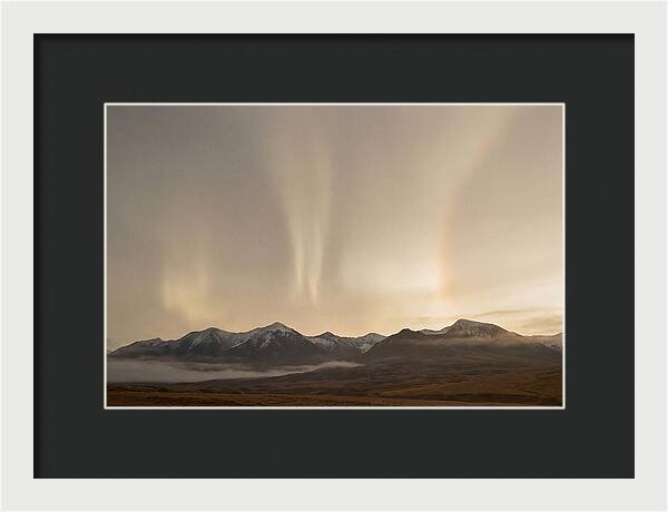 Aurora Pillars Rising Above Mountains