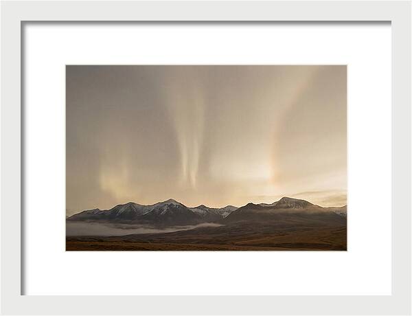 Aurora Pillars Rising Above Mountains