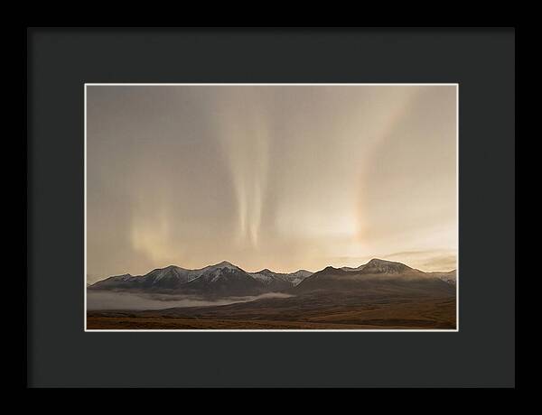 Aurora Pillars Rising Above Mountains