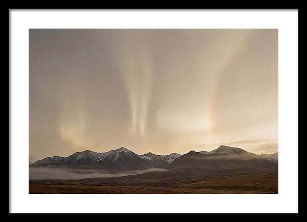 Aurora Pillars Rising Above Mountains