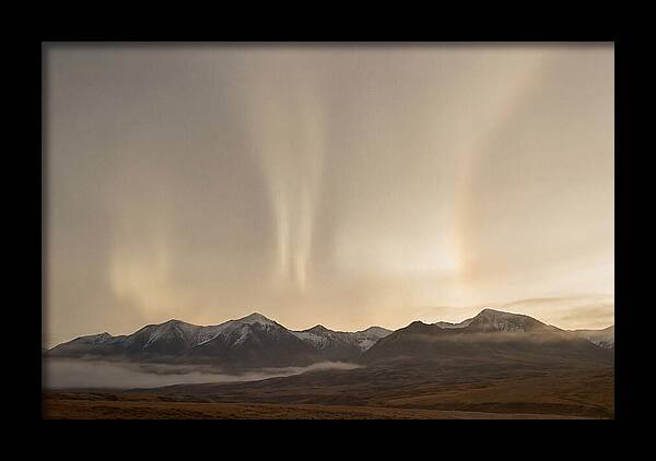 Aurora Pillars Rising Above Mountains