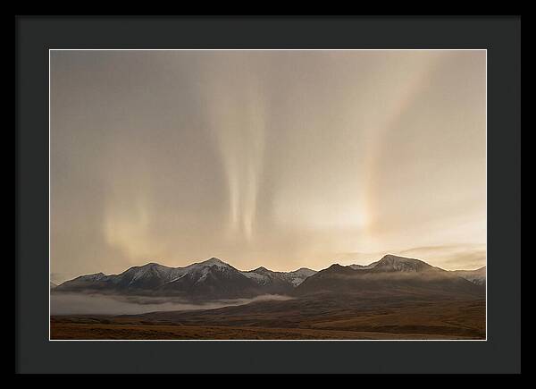 Aurora Pillars Rising Above Mountains