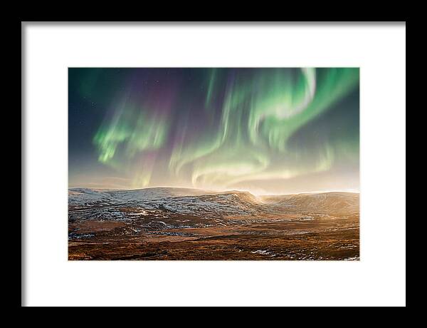 Aurora Swirling In Green And Purple