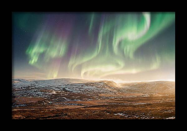 Aurora Swirling In Green And Purple