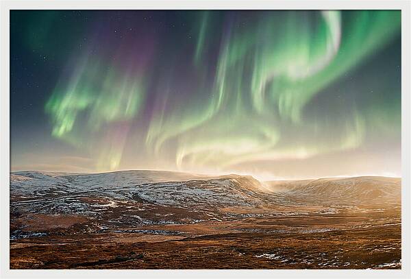 Aurora Swirling In Green And Purple