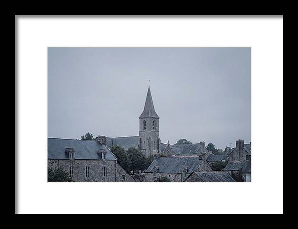 Bell Tower Rising Above Rooflines