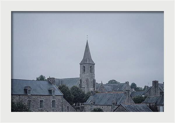 Bell Tower Rising Above Rooflines