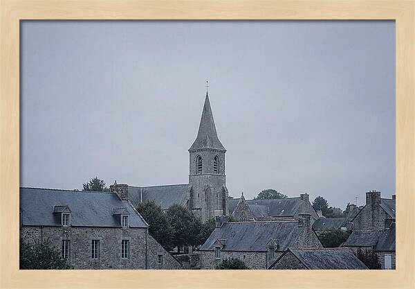 Bell Tower Rising Above Rooflines