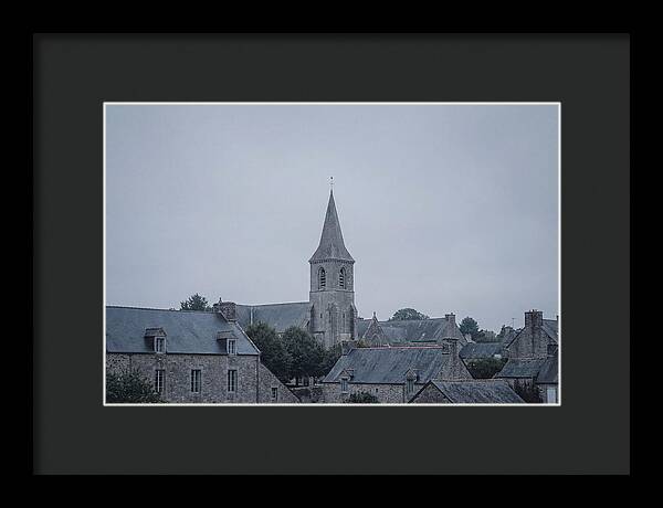 Bell Tower Rising Above Rooflines