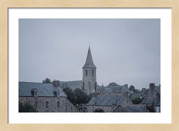 Bell Tower Rising Above Rooflines