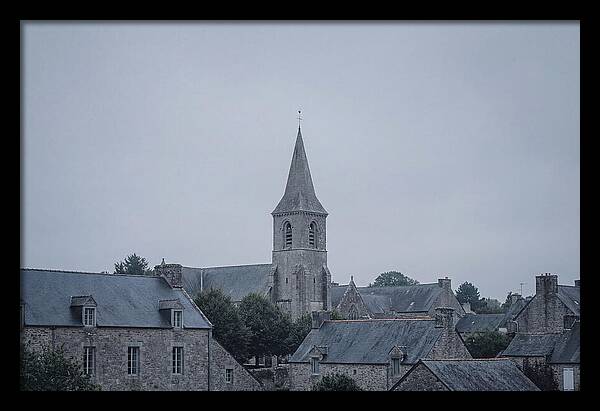 Bell Tower Rising Above Rooflines