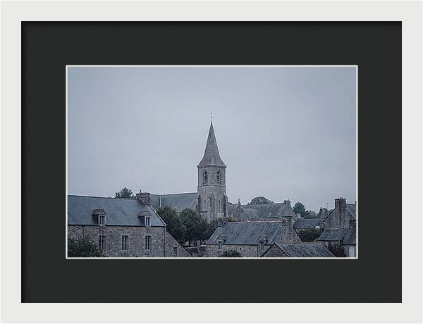 Bell Tower Rising Above Rooflines