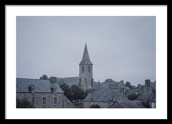 Bell Tower Rising Above Rooflines