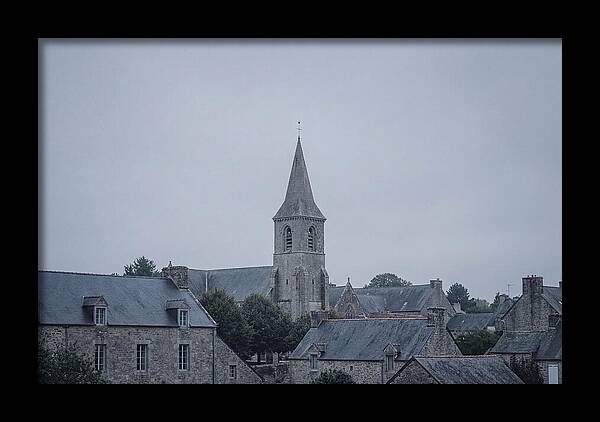 Bell Tower Rising Above Rooflines