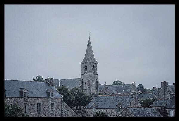 Bell Tower Rising Above Rooflines