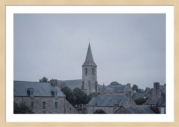 Bell Tower Rising Above Rooflines