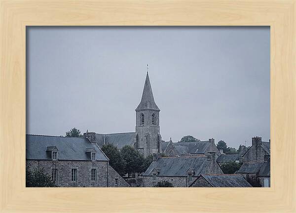 Bell Tower Rising Above Rooflines