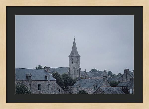 Bell Tower Rising Above Rooflines