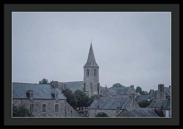 Bell Tower Rising Above Rooflines