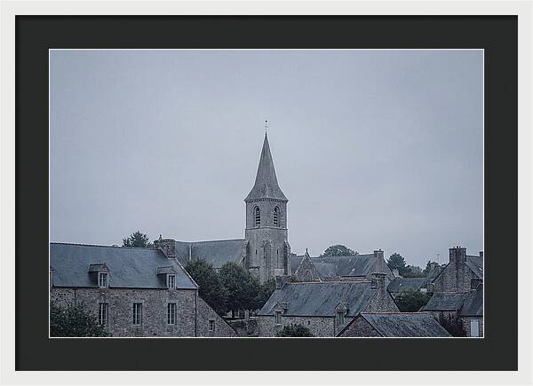 Bell Tower Rising Above Rooflines