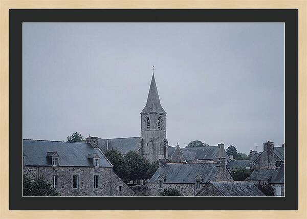 Bell Tower Rising Above Rooflines