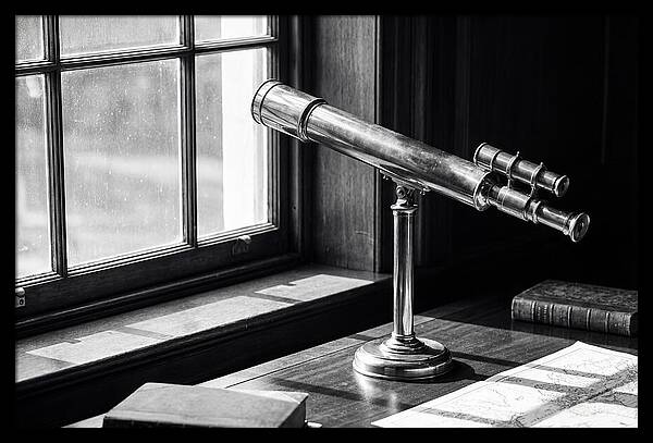 Brass Telescope On Mahogany Desk