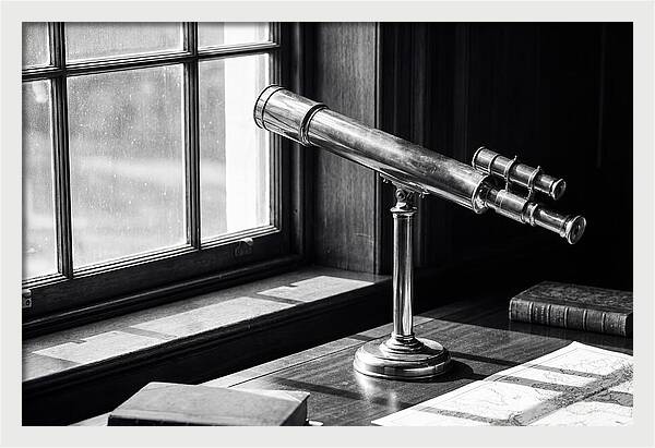 Brass Telescope On Mahogany Desk
