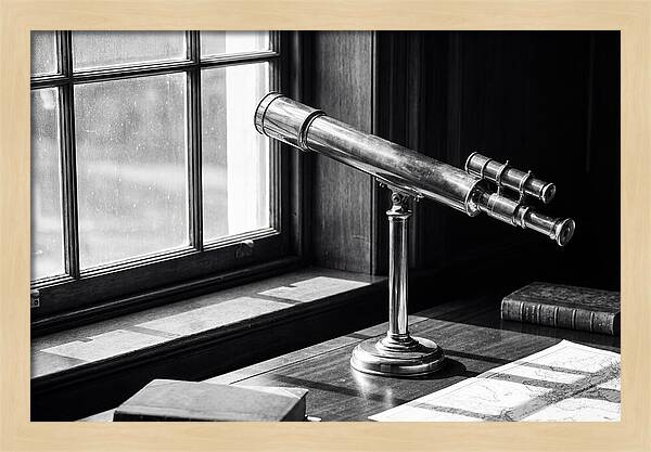 Brass Telescope On Mahogany Desk