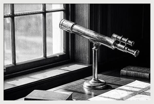 Brass Telescope On Mahogany Desk