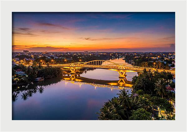Bridge Over City River At Dusk