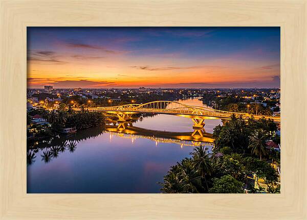 Bridge Over City River At Dusk