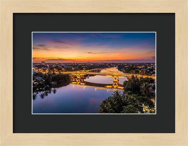 Bridge Over City River At Dusk