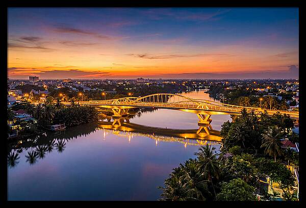 Bridge Over City River At Dusk
