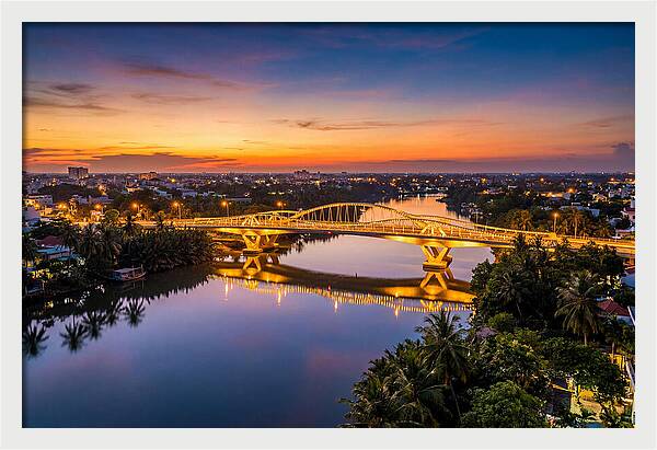Bridge Over City River At Dusk