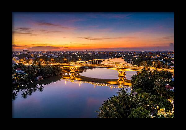 Bridge Over City River At Dusk