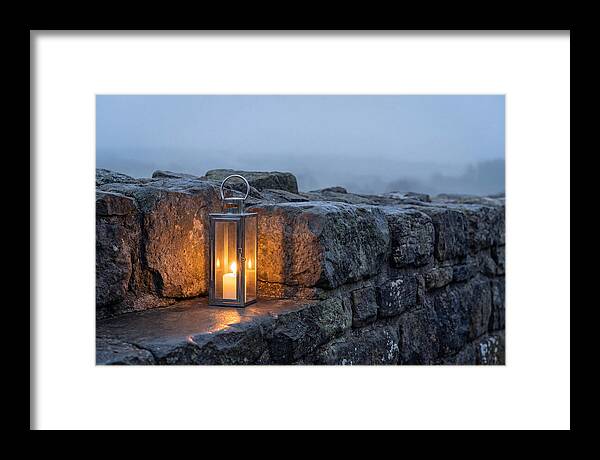 Candle Lantern Illuminating Stone Wall