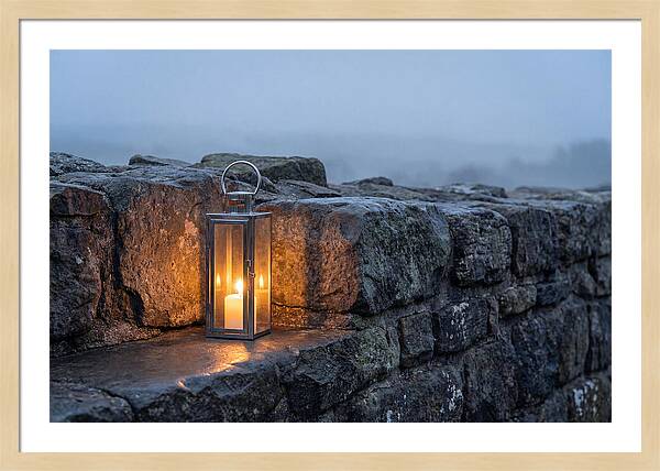 Candle Lantern Illuminating Stone Wall