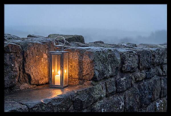 Candle Lantern Illuminating Stone Wall