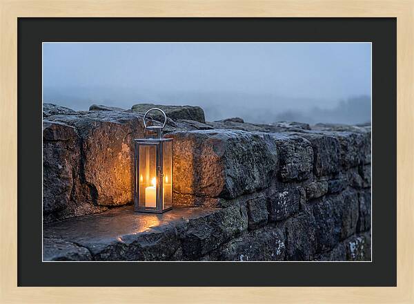 Candle Lantern Illuminating Stone Wall