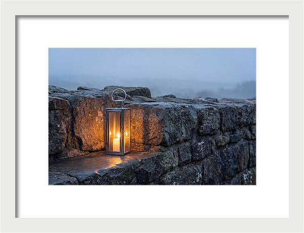 Candle Lantern Illuminating Stone Wall