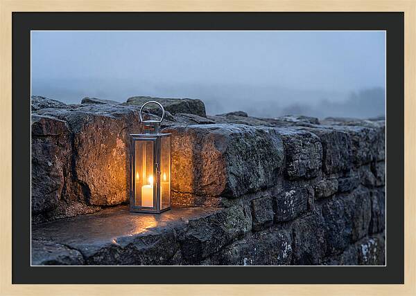 Candle Lantern Illuminating Stone Wall