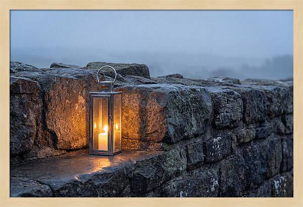 Candle Lantern Illuminating Stone Wall