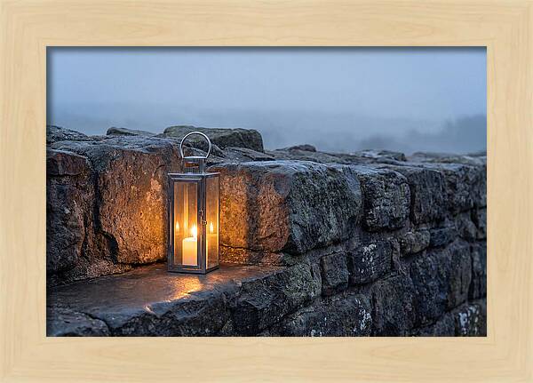 Candle Lantern Illuminating Stone Wall