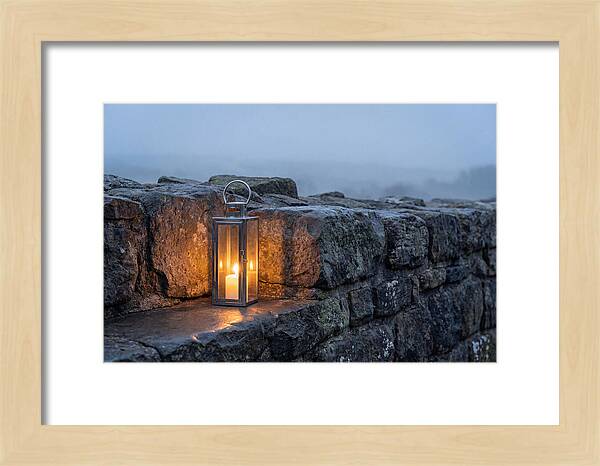 Candle Lantern Illuminating Stone Wall