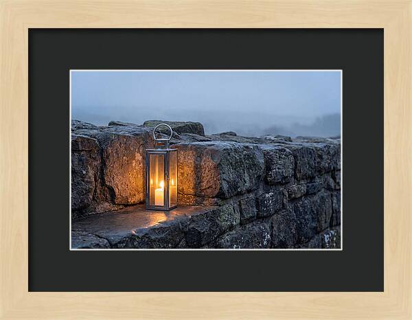 Candle Lantern Illuminating Stone Wall