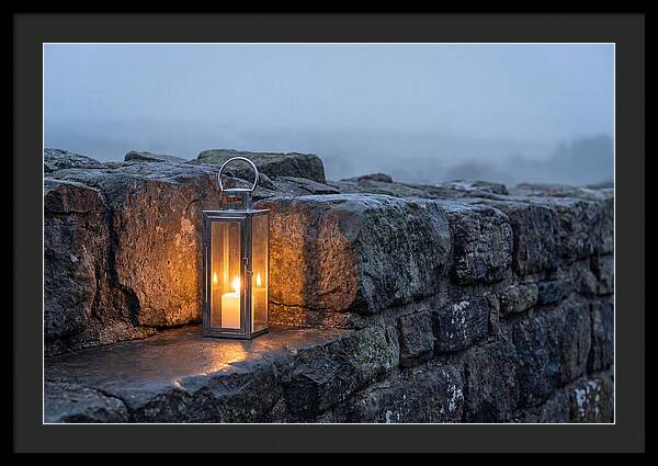 Candle Lantern Illuminating Stone Wall