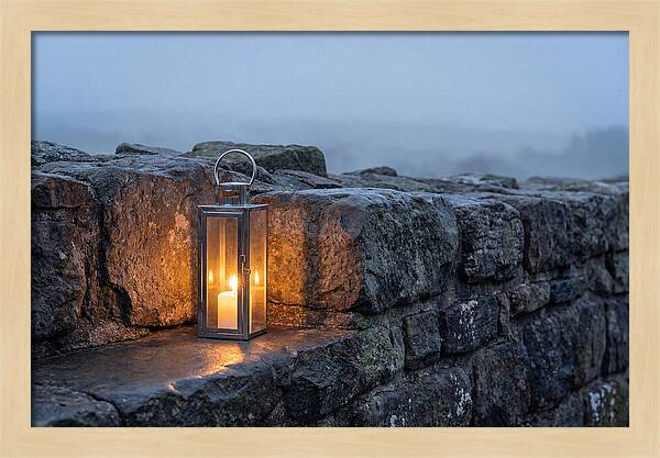 Candle Lantern Illuminating Stone Wall