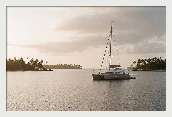 Catamaran Anchored In Tropical Lagoon