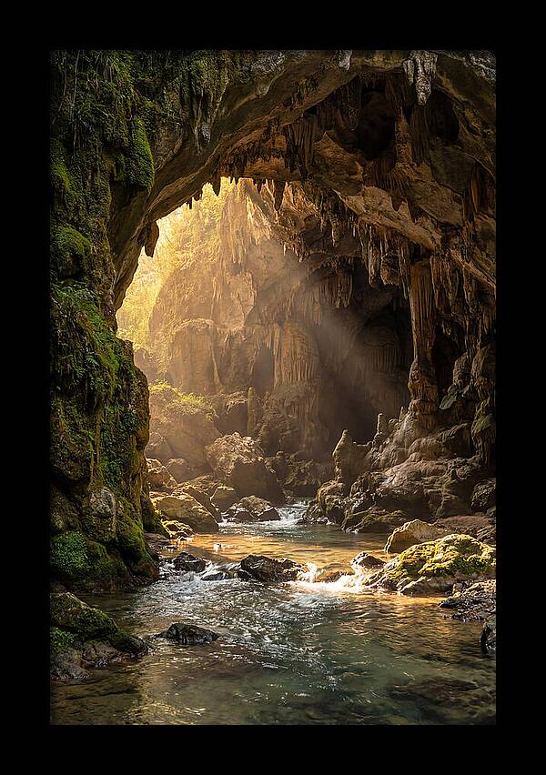 Cave Entrance Illuminated By Sunlight